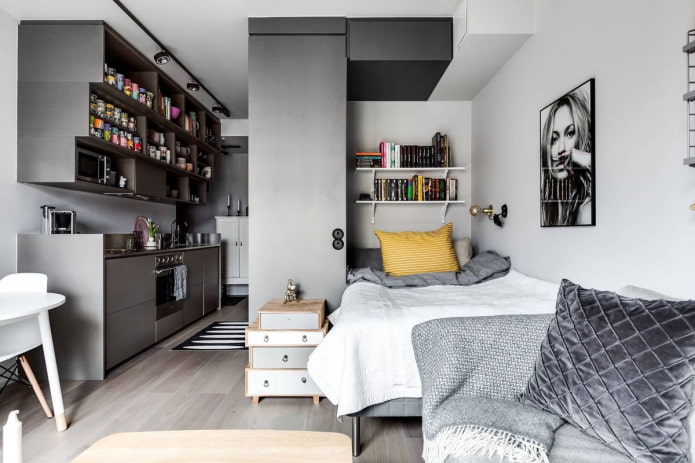 Schlafbereichsgestaltung im Innenraum eines Studio-Apartments