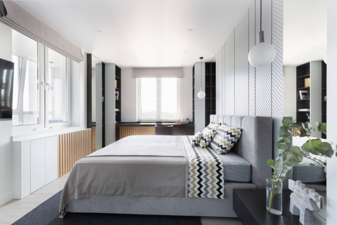 Schlafzimmer mit Fernseher an der Wand