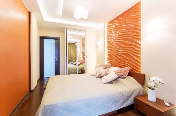orange 3D-Paneele an der Wand im Schlafzimmer