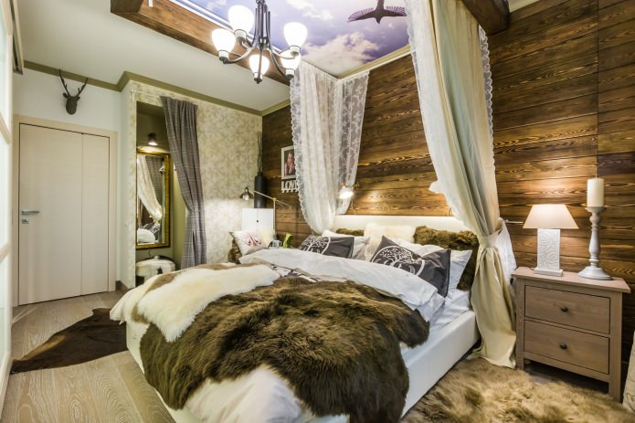 Schlafzimmer mit Holzwand