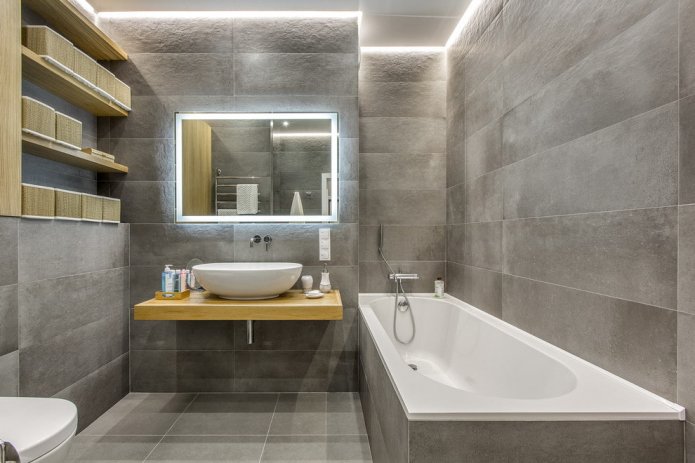 Badezimmer mit grauen Feinsteinzeugfliesen