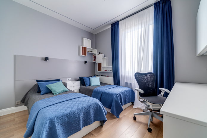 Interieur eines blau-grauen Kinderzimmers