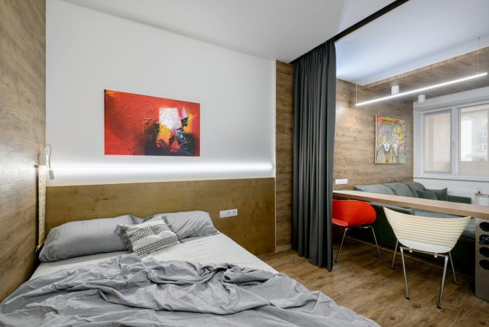 Bett und Sofa in einer Einzimmerwohnung