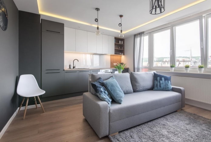 Küchenstudio-Interieur mit einer Trennwand in Form eines Sofas